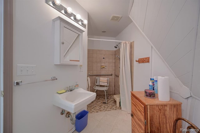 bathroom featuring tile patterned floors and a shower with shower curtain