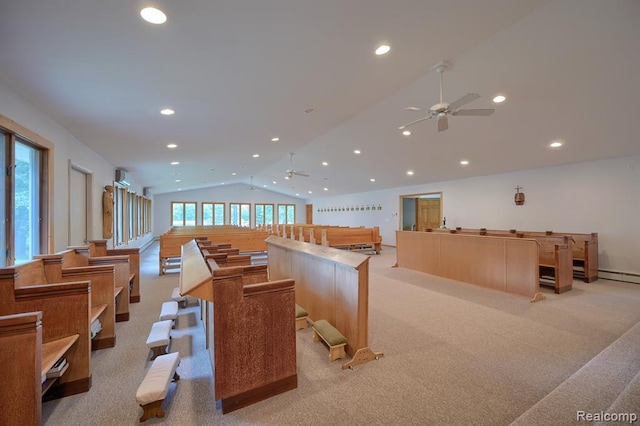 recreation room with ceiling fan, light colored carpet, and lofted ceiling