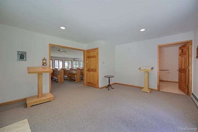 carpeted spare room with ceiling fan