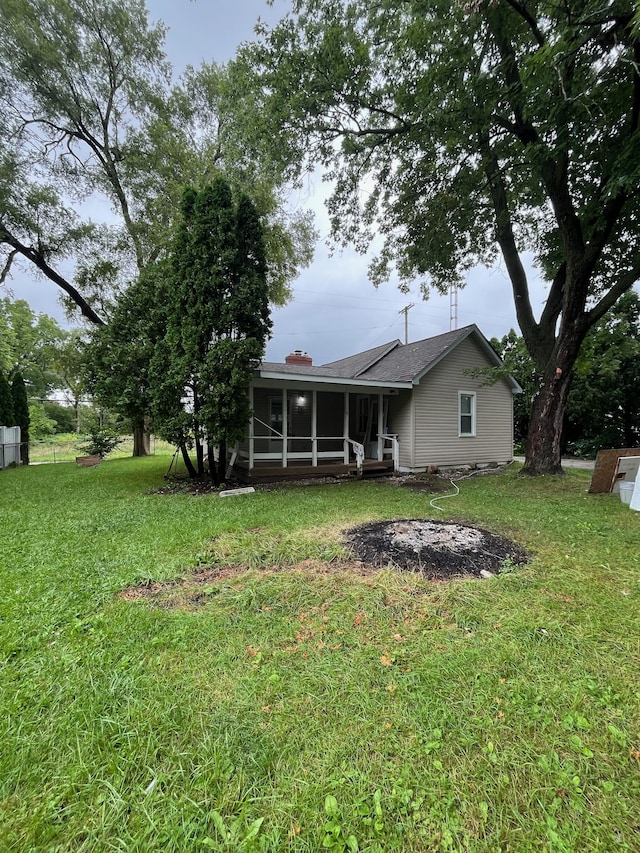 view of yard featuring a sunroom