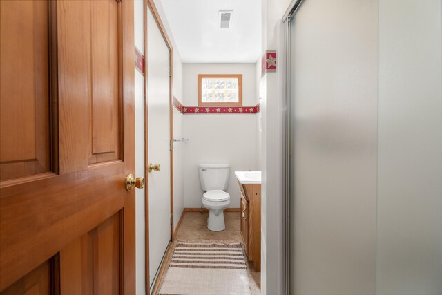 89 E Chicago St, Quincy, MI 49082 - bathroom featuring toilet, vanity, and an enclosed shower