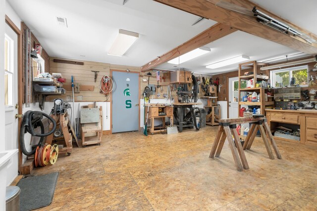 89 E Chicago St, Quincy, MI 49082 - garage with a workshop area and wooden walls