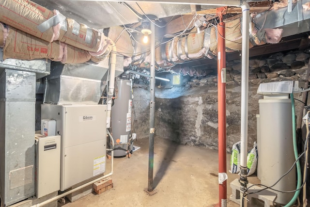 utility room featuring gas water heater and heating unit