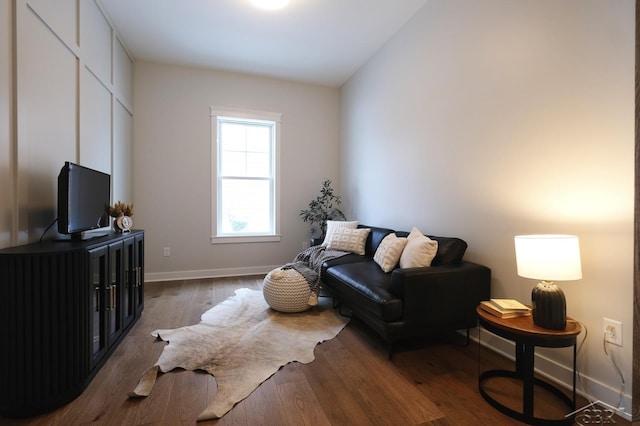 living room with dark hardwood / wood-style flooring and lofted ceiling