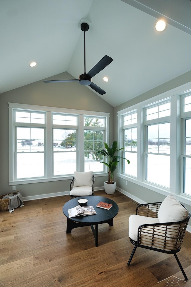 sunroom featuring vaulted ceiling and ceiling fan