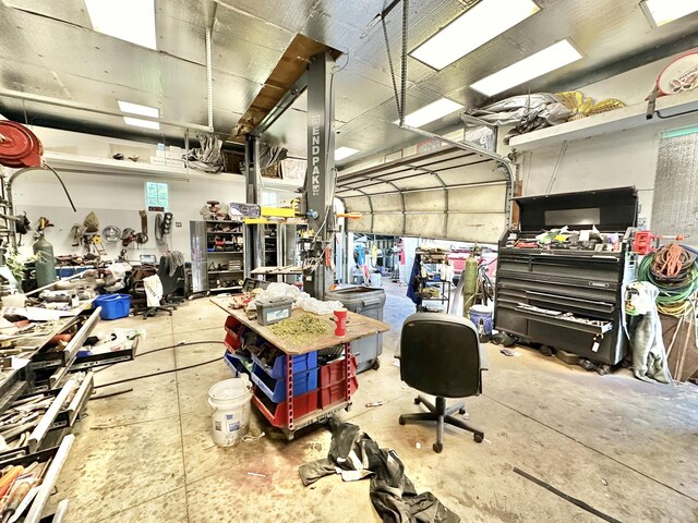 2715 Duck Lake Rd N, Highland, MI 48356 - garage featuring a workshop area