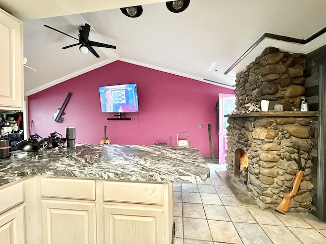 2715 Duck Lake Rd N, Highland, MI 48356 - kitchen with ceiling fan, lofted ceiling, a fireplace, and light tile patterned floors