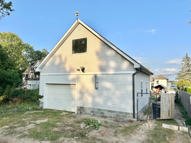 view of side of property with a garage