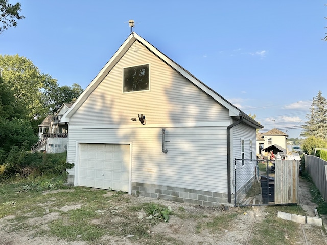 2715 Duck Lake Rd N, Highland, MI 48356 - view of home's exterior with a detached garage