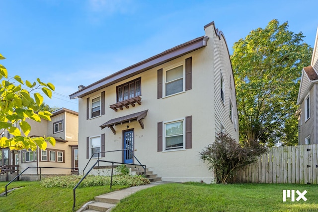 view of front of home featuring a front lawn