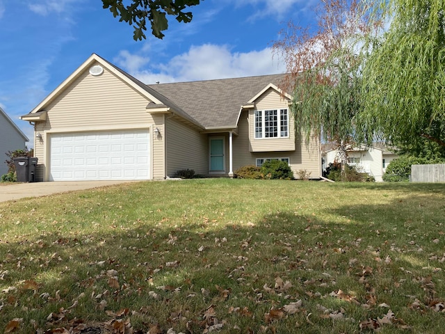 view of front of property featuring a front yard and a garage