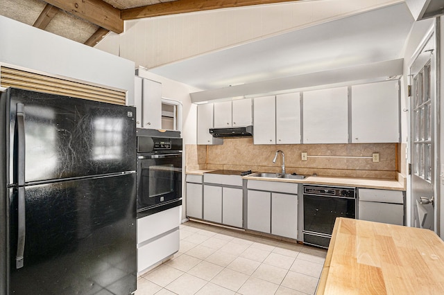 kitchen featuring backsplash, sink, black appliances, vaulted ceiling with beams, and white cabinetry