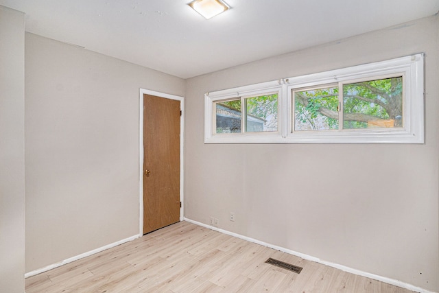 unfurnished room featuring light hardwood / wood-style flooring