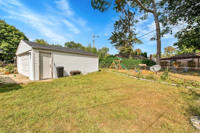 view of yard with a garage and an outdoor structure