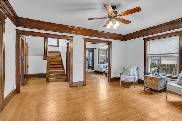 sitting room featuring ceiling fan, light hardwood / wood-style flooring, and ornamental molding