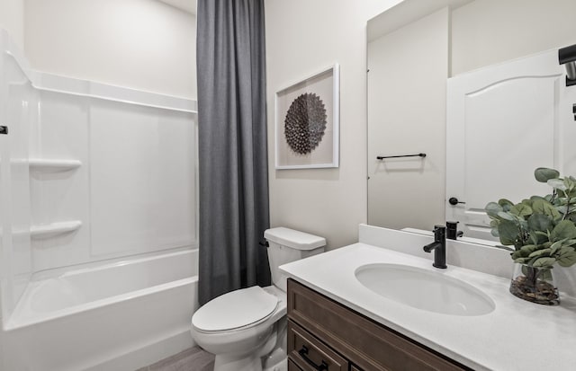 full bathroom featuring toilet, shower / bath combo, and vanity