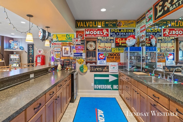 bar with wine cooler, sink, light tile patterned flooring, and pendant lighting