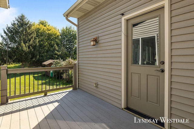 wooden deck with a yard