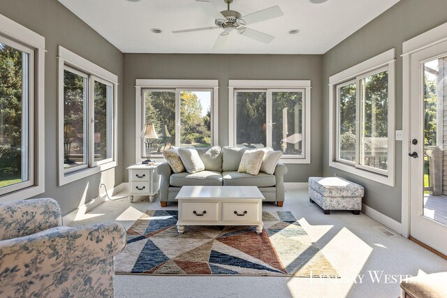 sunroom featuring ceiling fan