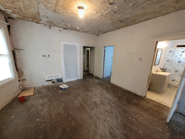 interior space featuring hardwood / wood-style flooring and baseboard heating