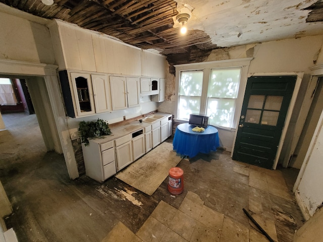 kitchen featuring white cabinets and sink