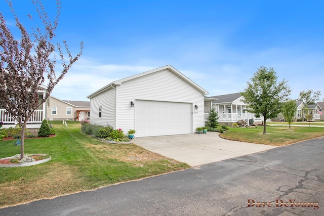 single story home featuring a garage and a front lawn