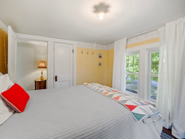 bedroom with carpet floors and a closet