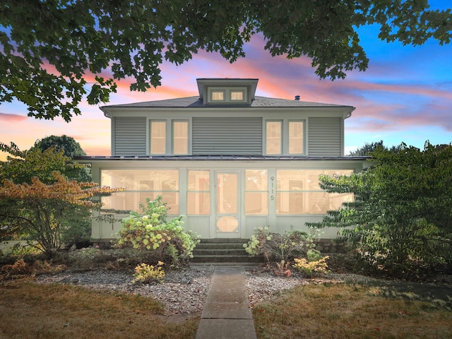 view of front facade featuring a sunroom