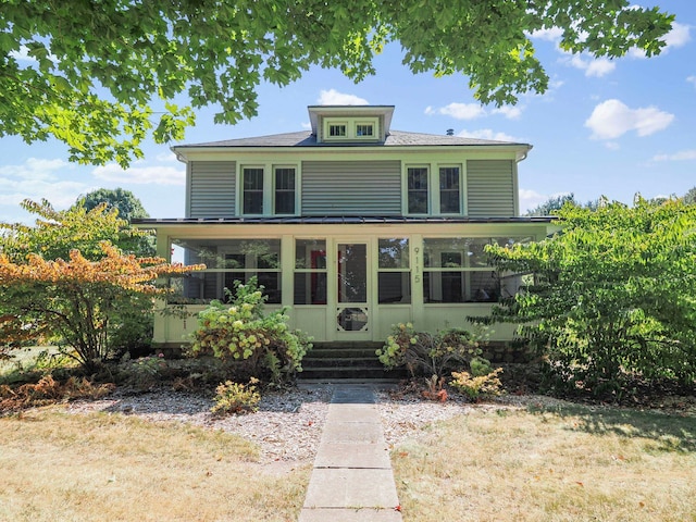 view of front of property with a sunroom