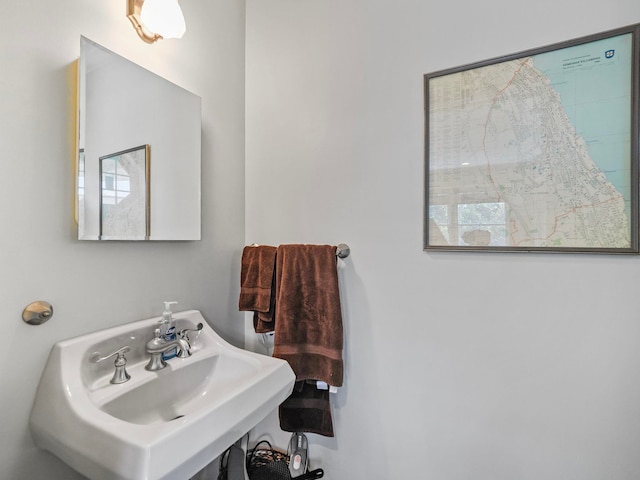 bathroom with a wealth of natural light and sink