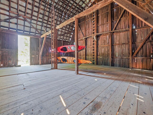 miscellaneous room featuring a towering ceiling