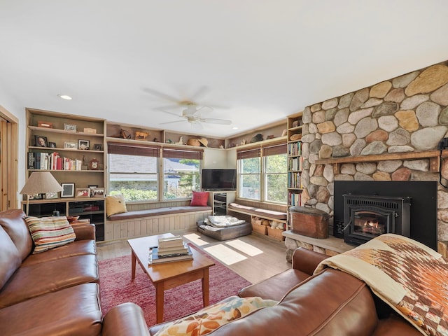 living room featuring hardwood / wood-style floors and ceiling fan