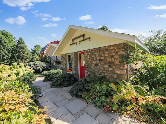 doorway to property with a patio area