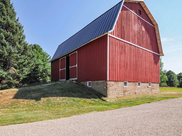 view of outbuilding with a lawn