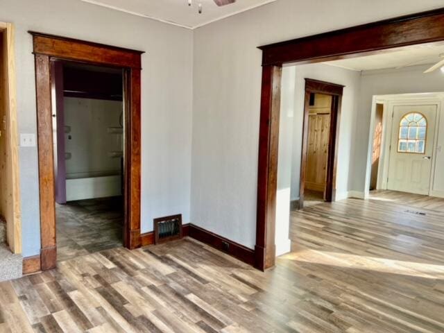 empty room featuring hardwood / wood-style floors and ceiling fan