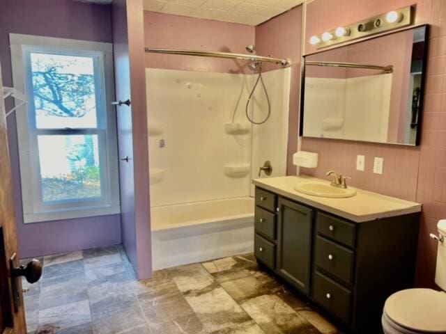 full bathroom with vanity, toilet, and shower / washtub combination