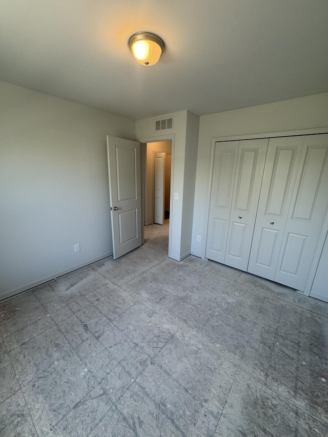 411 Mason Run Blvd, Monroe, MI 48162 - unfurnished bedroom with baseboards and a closet