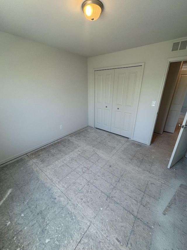 411 Mason Run Blvd, Monroe, MI 48162 - unfurnished bedroom with a closet and baseboards