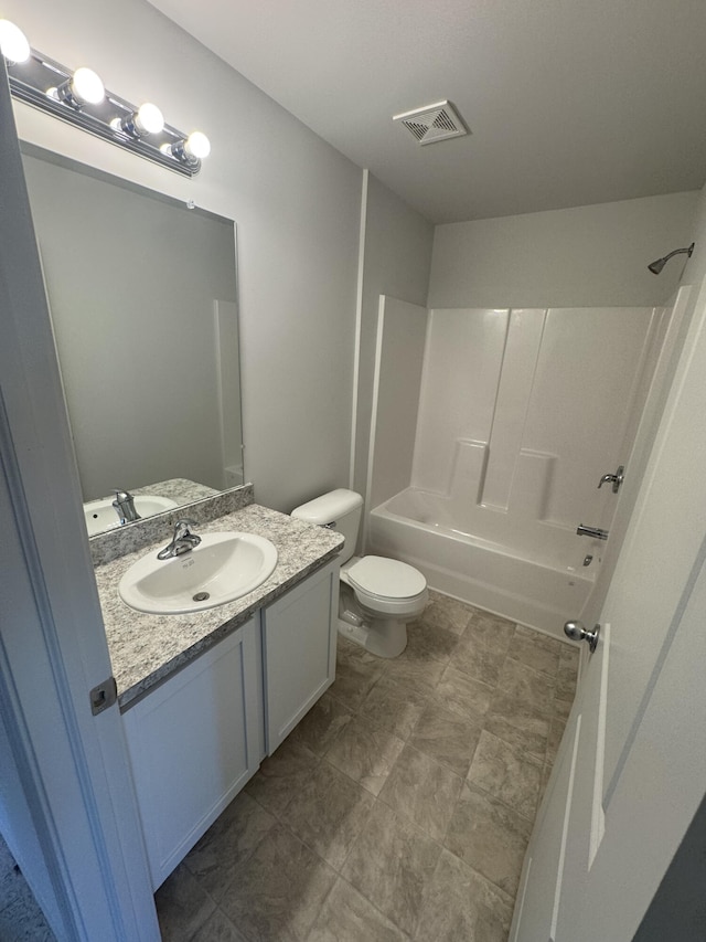 411 Mason Run Blvd, Monroe, MI 48162 - bathroom featuring vanity, washtub / shower combination, and toilet