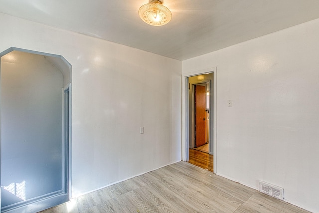 spare room featuring light hardwood / wood-style floors