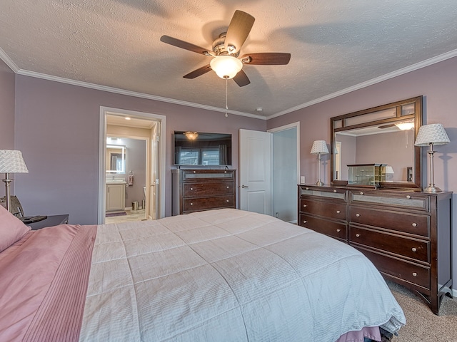 carpeted bedroom featuring a textured ceiling, ceiling fan, ornamental molding, and connected bathroom