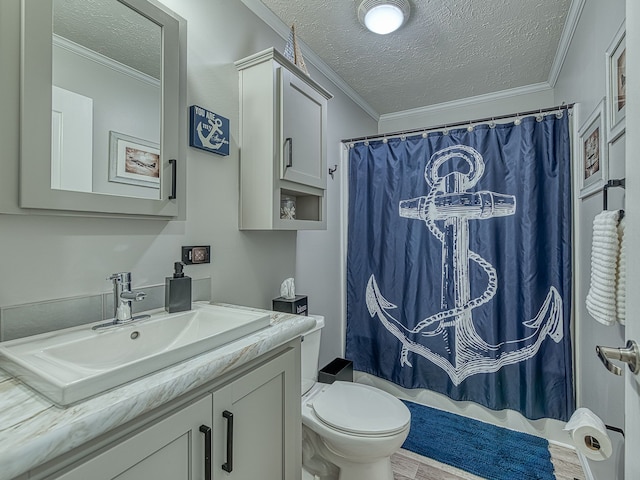 bathroom with vanity, a textured ceiling, crown molding, hardwood / wood-style floors, and toilet