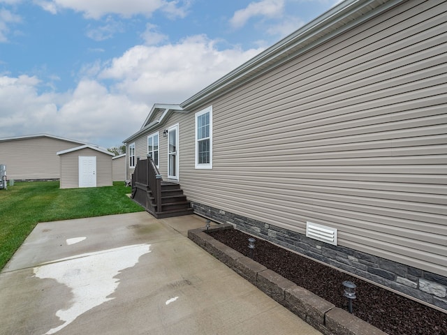 view of patio with a storage shed