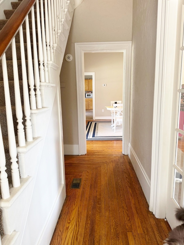 hallway featuring hardwood / wood-style floors