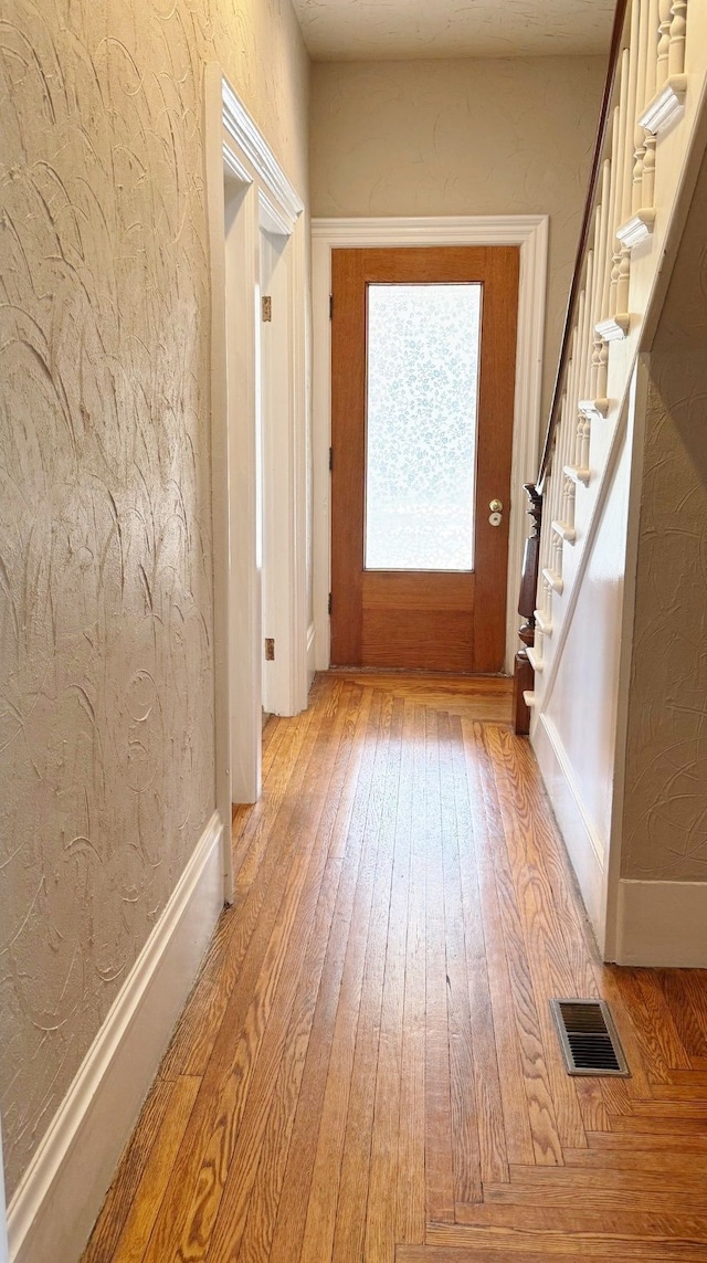 entryway with light hardwood / wood-style floors