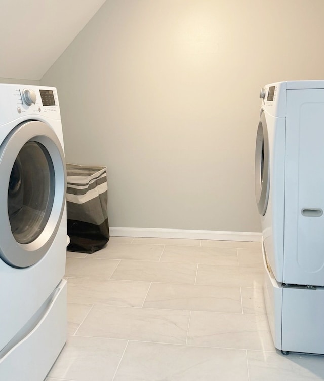 clothes washing area with independent washer and dryer