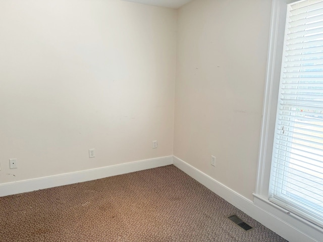 empty room featuring carpet flooring