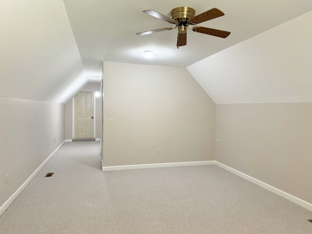 bonus room featuring light colored carpet, vaulted ceiling, and ceiling fan