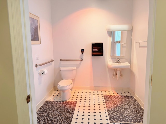 bathroom with toilet and sink