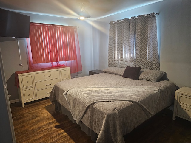 bedroom featuring ceiling fan and dark hardwood / wood-style floors